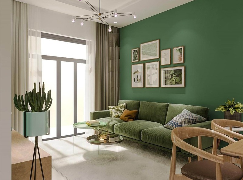 Không gian phòng khách ấn tượng với bộ sofa màu xanh cùng bức tường tông xanh đồng điệu
