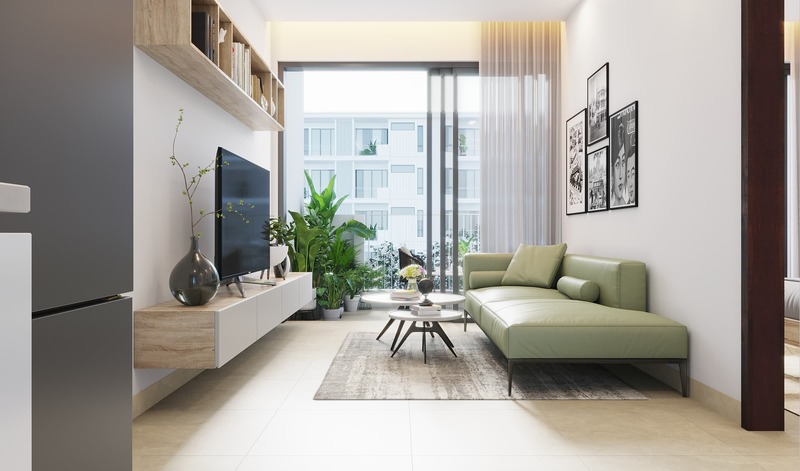 Phòng khách được lắp đặt ô cửa kính lớn đón ánh sáng  tự nhiên, kết hợp với màu trắng chủ đạo làm cho không gian thêm thoáng rộng
