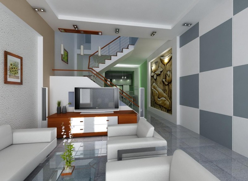 Bức tường phòng khách được ốp lát gạch xen kẽ hai tông màu xanh và xám ấn tượng, thiết kế không gian liên thông với phòng bếp tạo cảm giác rộng rãi